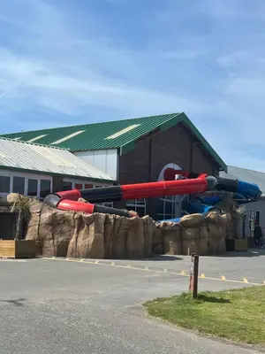 a water slide in front of a building at Static Caravan in Moffat