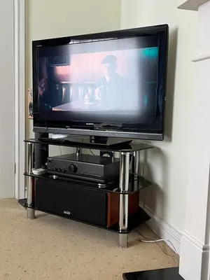 a flat screen tv sitting on a stand at 2 bedroom Lake district cottage in Cockermouth