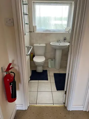 a bathroom with a toilet and a sink at 2 bedroom Lake district cottage in Cockermouth