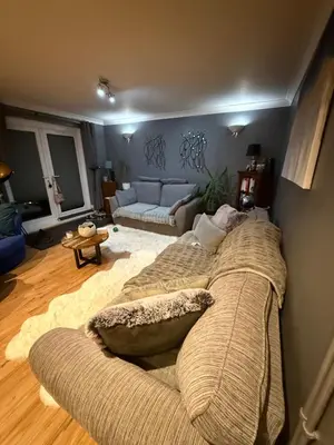 a living room with a large couch in a living room at Traveler Nest in Moffat