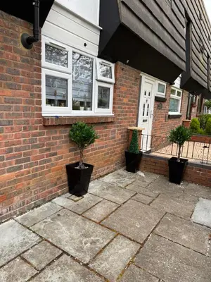 a brick house with two potted plants in front of it at Traveler Nest in Moffat