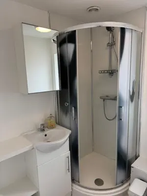 a bathroom with a shower and a sink at One bedroom studio in Moffat