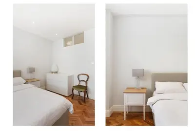 a bedroom with two beds and a chair and a table at 2 Bedroom Apartment Queensway in Moffat
