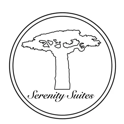 a black and white drawing of a tree in a circle at Serenity Suites in Douglas