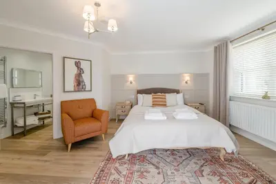 a bedroom with a bed and a chair and a desk at 1 Bed in Dalston oc-s32206 in Dalston