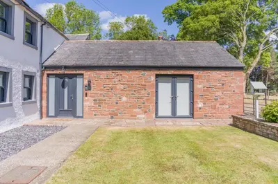 a brick cottage with a door and a yard at 1 Bed in Dalston oc-s32206 in Dalston