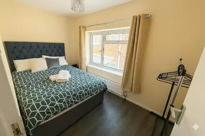 a bedroom with a bed and a window at Nayla house in Moffat