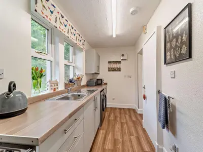 a kitchen with a sink and a counter at 2 Bed in Maybole 96012 in Maybole