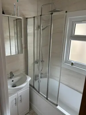 a bathroom with a shower and a sink at Flat in Moffat