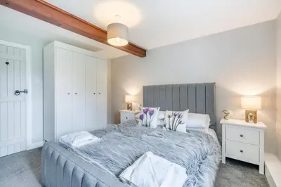 a bedroom with a large bed and two night stands at 2 Bed in Troutbeck oc-b32579 in Troutbeck