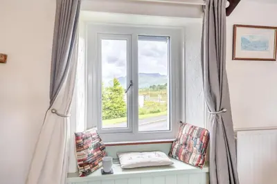 a window in a room with a bench in front at 2 Bed in Troutbeck oc-s32564 in Troutbeck