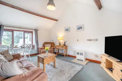 a living room with a couch and a flat screen tv at 2 Bed in Troutbeck oc-s32564 in Troutbeck