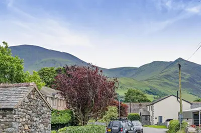 a street in a village with mountains in the background at 2 Bed in Ormathwaite oc-s32385 in Applethwaite
