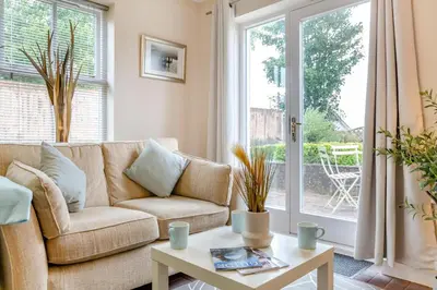 a living room with a couch and a table at 2 Bed in Aspatria oc-p32645 in Aspatria