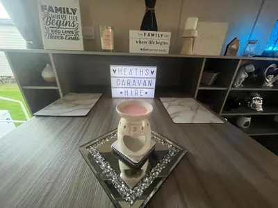 a vase sitting on a table in a shelf at the heaths caravan hire Craig Tara in Minishant