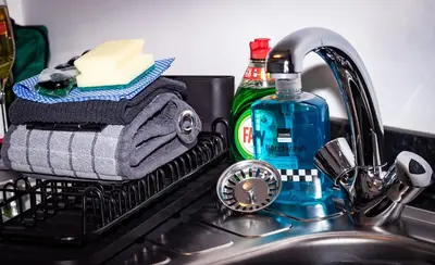 a dish drying rack sitting next to a sink at Bega House Apartment in Whitehaven