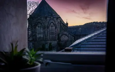 an image of a church from a window at Bega House Apartment in Whitehaven