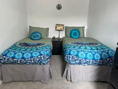 two beds sitting next to each other in a room at Stay Still Indian Court in Dalston