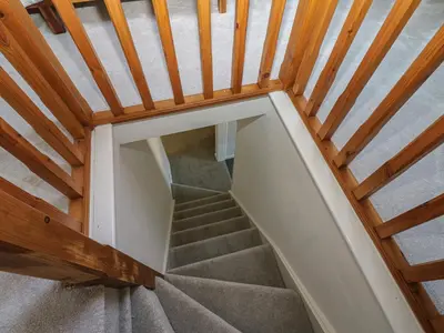 a stairwell in a house with a wooden ceiling at Lonsdale Street in Workington