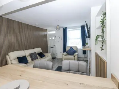 a living room with a couch and a table at Keekle Terrace in Cleator Moor