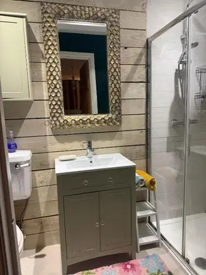a bathroom with a sink and a mirror at The Rookery in Moffat
