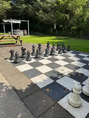a giant chessboard on a sidewalk in a park at Lower Milntown Farm in Ramsey