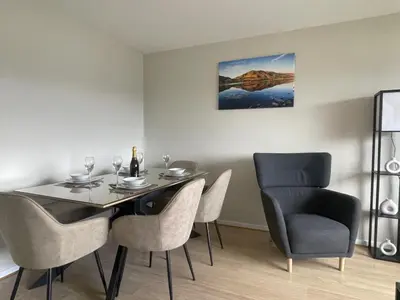 a dining room with a table and chairs at Skiddaw Heights in Keswick