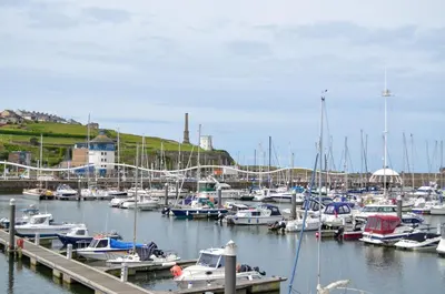 a bunch of boats docked in a harbor at Birks Terrace - 2 Bedroom - Sleeps 4 in Cleator Moor
