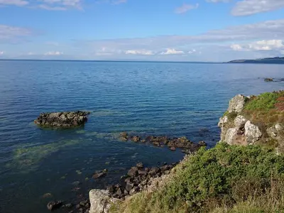 a large body of water with rocks in it at Learig Lodge in Girvan