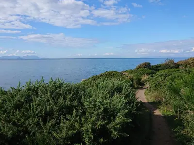a trail leading down to the ocean on a hill at Learig Lodge in Girvan