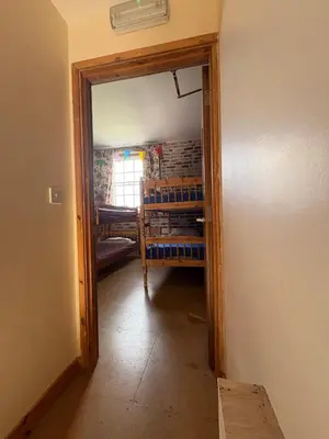 a hallway with a door open to a room at Hillside Farm in Carlisle
