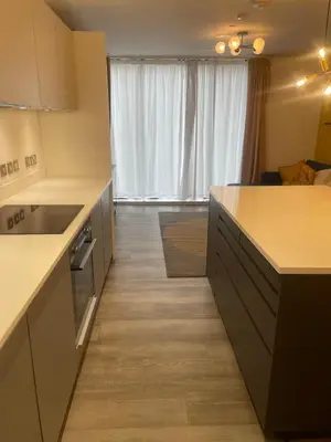 a kitchen with a sink and a counter top at The Bank Tower in Moffat