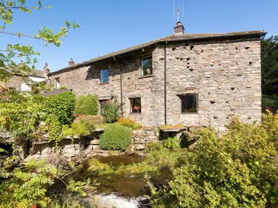 an old stone building with plants in front of it at 4 Bed in Cockermouth oc-sz098 in Lorton