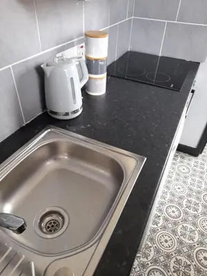 a kitchen counter with a sink and a coffee maker at Studio No4, Cockermouth The Lakes in Cockermouth