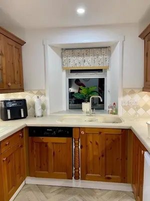 a kitchen with a sink and a window at Relax by the River, at Millgreen House in Dumfries