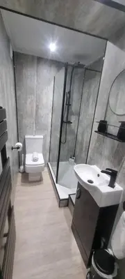 a bathroom with a shower and a sink and a toilet at Studio No1, Cockermouth, The Lakes in Cockermouth