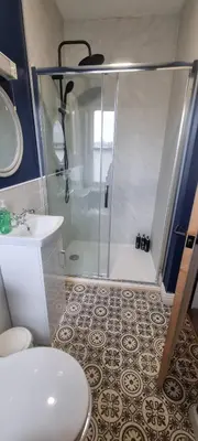a bathroom with a shower and a toilet and a sink at Studio No5, Cockermouth The Lakes in Cockermouth