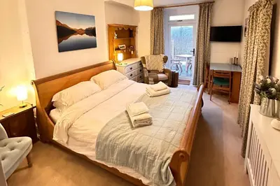 a bedroom with a bed with two towels on it at Lorton View, nestles on the fellside with walks from the door close to Lorton in Lorton