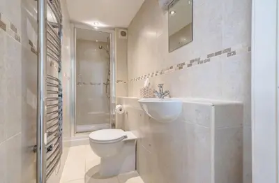 a bathroom with a toilet and a sink and a shower at 22 Thrang Brow - Langdale Valley in Chapel Stile