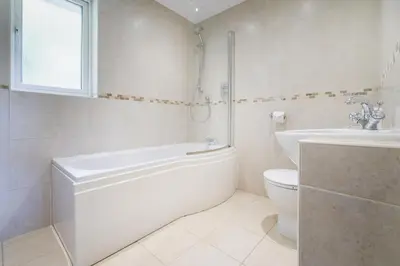 a bathroom with a tub and a toilet and a sink at 22 Thrang Brow - Langdale Valley in Chapel Stile