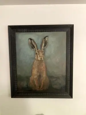 a picture of a painting of a rabbit on a wall at The Cart Barn in Moffat
