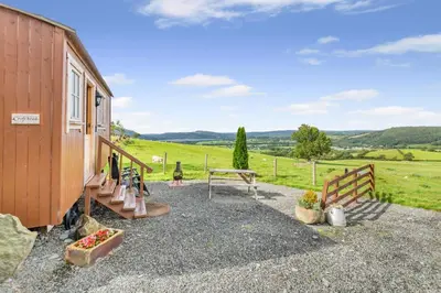 a house with a picnic table and a fence at 1 Bed in Keswick oc-c33119 in Bassenthwaite