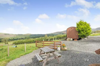 a picnic table in front of a barn at 1 Bed in Keswick oc-f33118 in Bassenthwaite