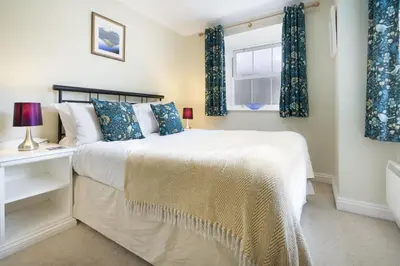 a bedroom with a bed and a window at The Screes Apartment - Short stroll from Wastwater - Herdwick Cottages