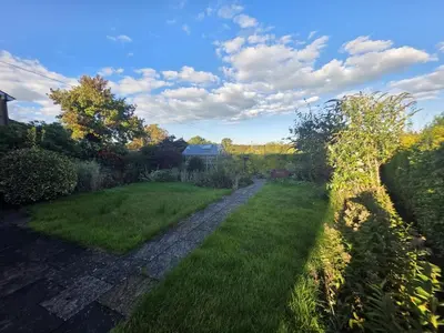 a path in a garden with green grass at Lovely 3 Bedroom House 5 Minutes M6 or Carlisle in Carlisle