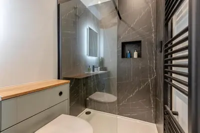 a bathroom with a shower with a toilet and a sink at 1 Bed in Wetheral oc-r32933 in Wreay