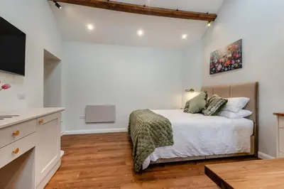 a bedroom with a bed and a tv in a room at 1 Bed in Wetheral oc-g32934 in Wreay