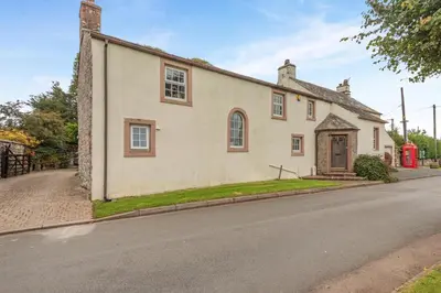 an old house on the side of a street at 4 Bed in Ellonby oc-y33284 in Ellonby