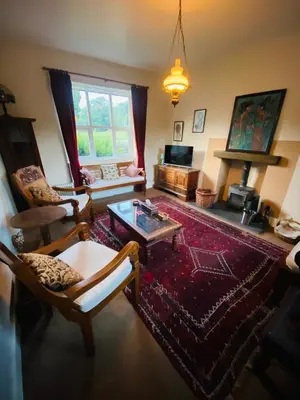 a living room with a couch and a coffee table at School House in Patterdale