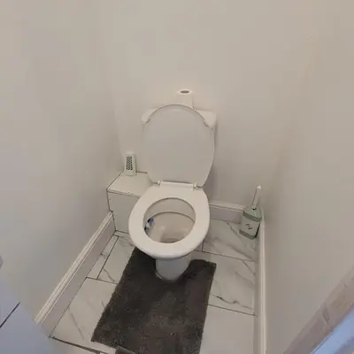 a bathroom with a white toilet in a room at 3 Bedroom house Abbey wood London in Moffat